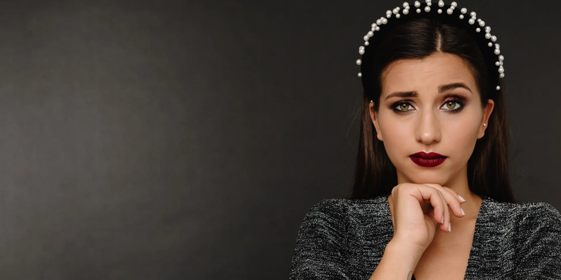 Beauty student wearing a pearl headband with evening makeup by Venera Academy